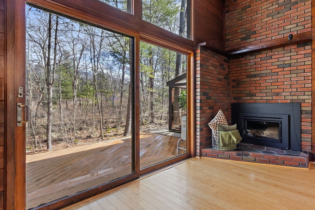 33 Turning Mill Road Lexington, MA 02420 - Photo 8 of 42 a view of empty room with wooden floor and a fireplace