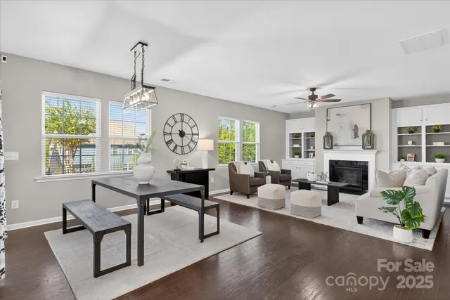 a view of a livingroom with furniture window and wooden floor