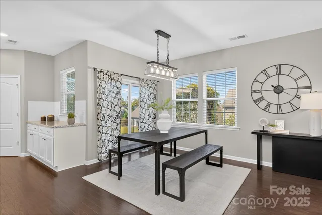 a view of a livingroom with furniture window and wooden floor
