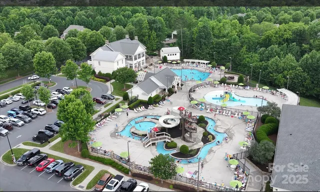 an aerial view of a house with an outdoor space