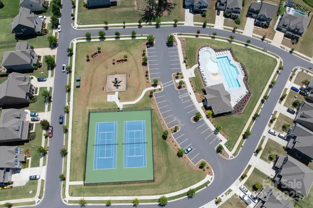 an aerial view of a house with a swimming pool