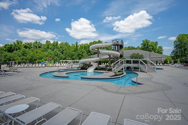 a view of a backyard with sitting area