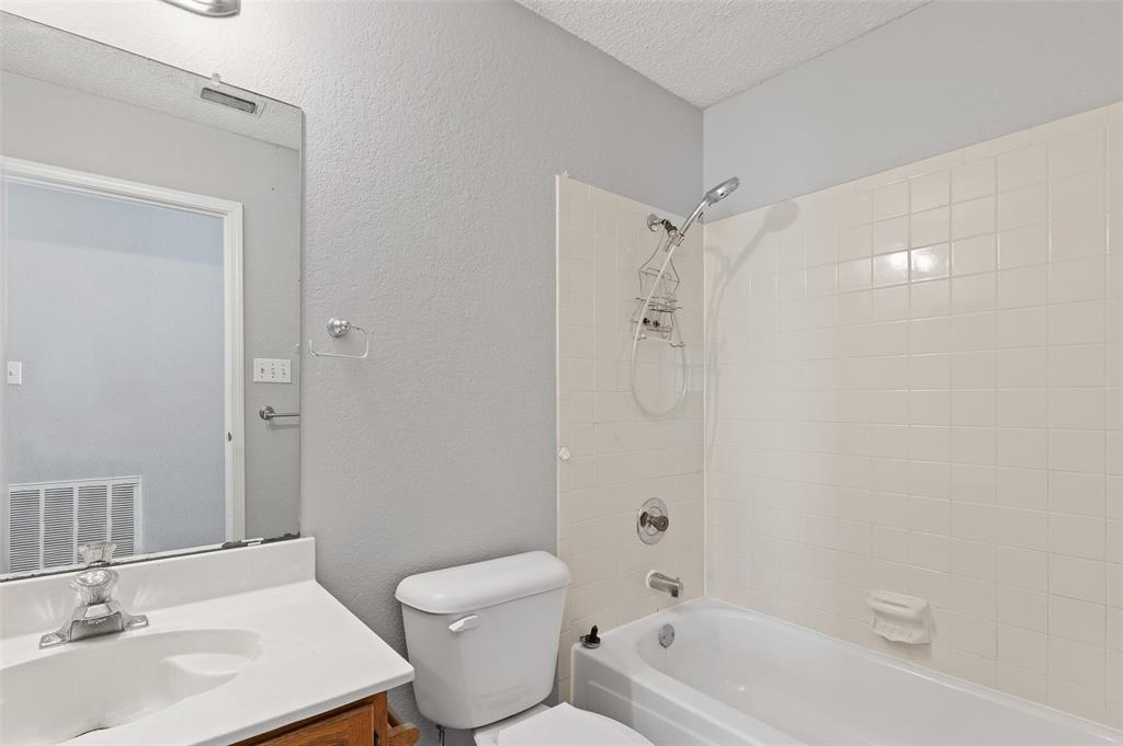 3521 Glenview Drive Corinth, TX 76210 - Photo 10 of 24 a bathroom with a sink toilet and shower