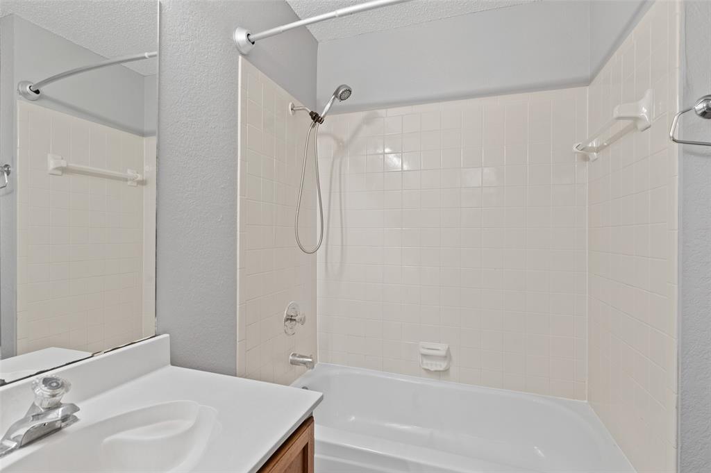 3521 Glenview Drive Corinth, TX 76210 - Photo 14 of 24 a bathroom with a shower and a sink