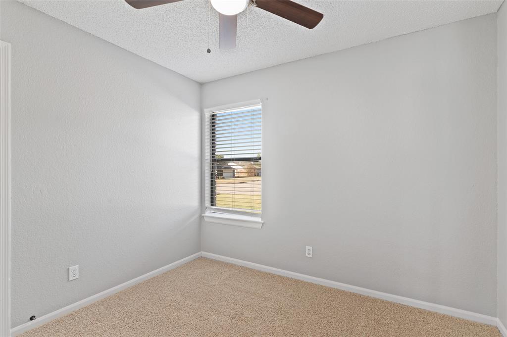 3521 Glenview Drive Corinth, TX 76210 - Photo 15 of 24 an empty room with a window