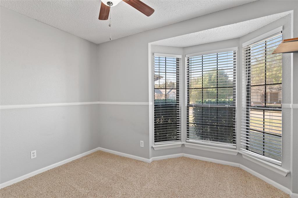 3521 Glenview Drive Corinth, TX 76210 - Photo 17 of 24 a view of an empty room with a window