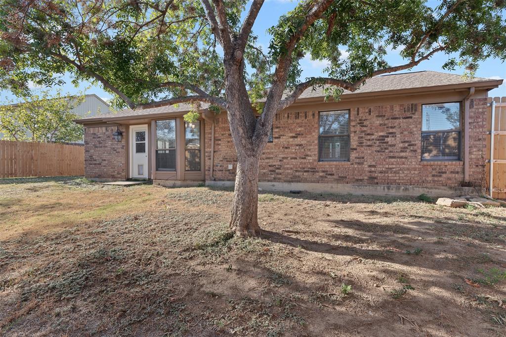 3521 Glenview Drive Corinth, TX 76210 - Photo 20 of 24 a front view of a house with a yard and garage