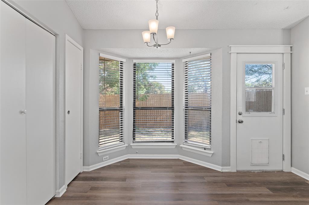 3521 Glenview Drive Corinth, TX 76210 - Photo 5 of 24 a view of empty room with wooden floor and fan