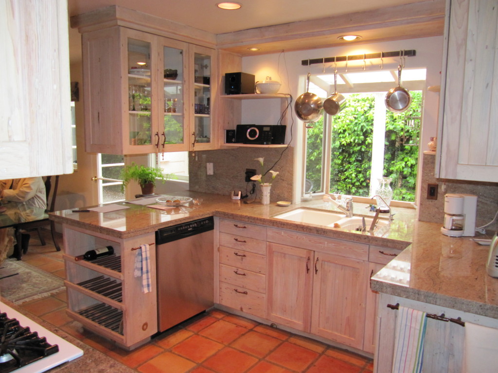 2184 East Valley Road Montecito, CA 93108 - Photo 3 of 5 a kitchen with kitchen island granite countertop a sink appliances cabinets and a counter top space