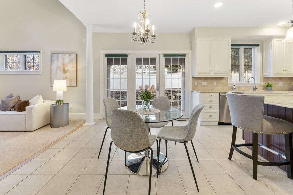 21 Ellison Road Lexington, MA 02421 - Photo 13 of 42 a view of a dining room with furniture and chandelier
