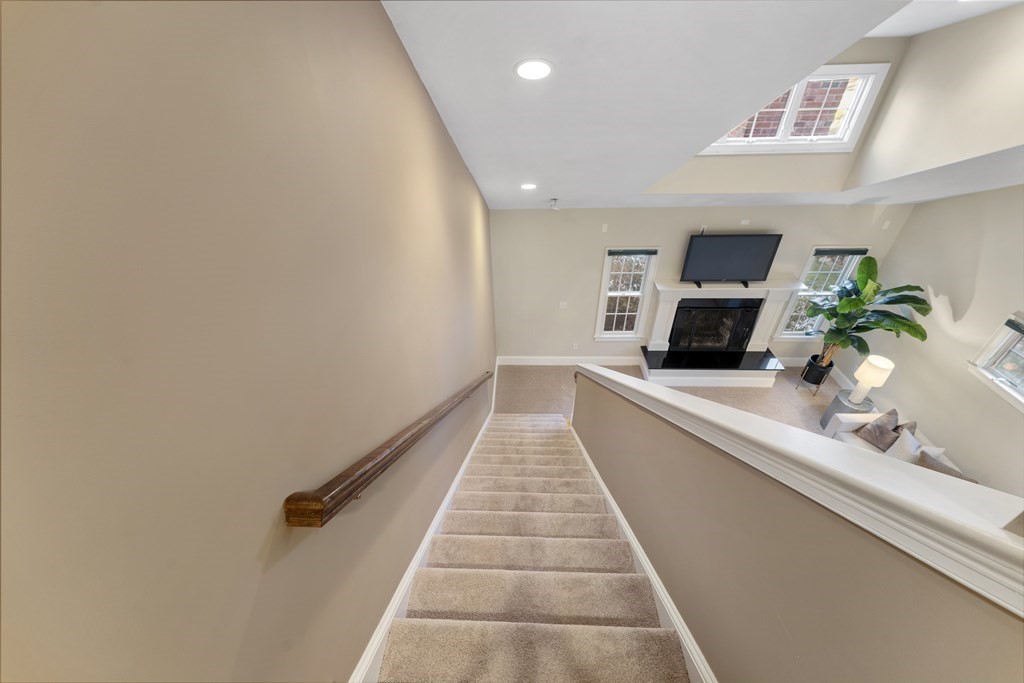 21 Ellison Road Lexington, MA 02421 - Photo 16 of 42 a view of a hallway with wooden floor and a potted plant