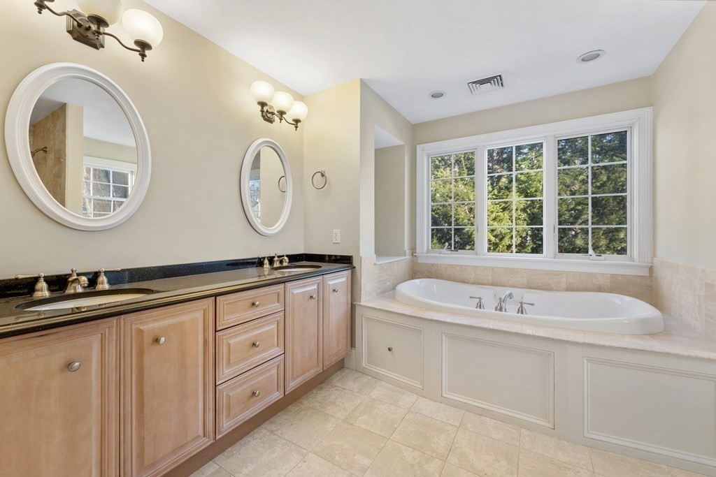 21 Ellison Road Lexington, MA 02421 - Photo 20 of 42 a bathroom with a sink and a large mirror