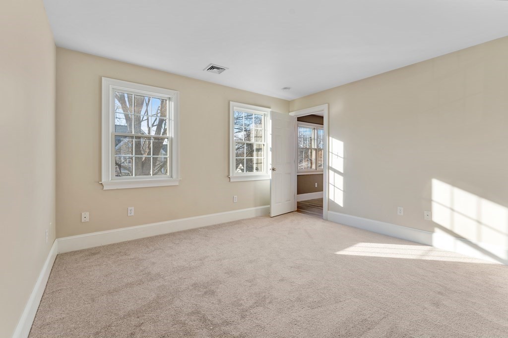 21 Ellison Road Lexington, MA 02421 - Photo 21 of 42 an empty room with windows and closet