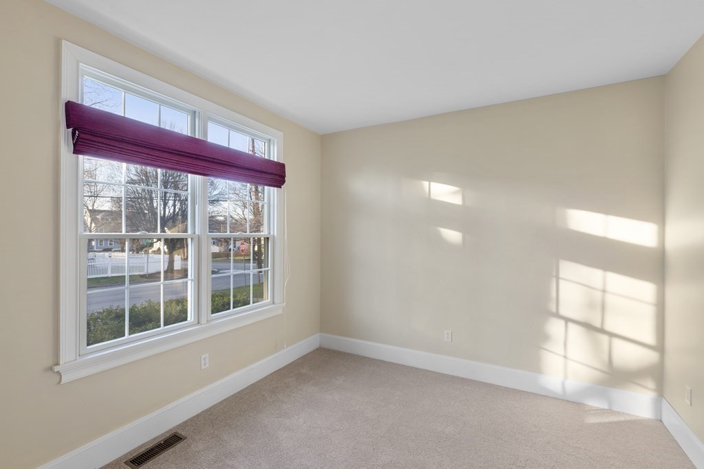 21 Ellison Road Lexington, MA 02421 - Photo 28 of 42 a view of an empty room with a window