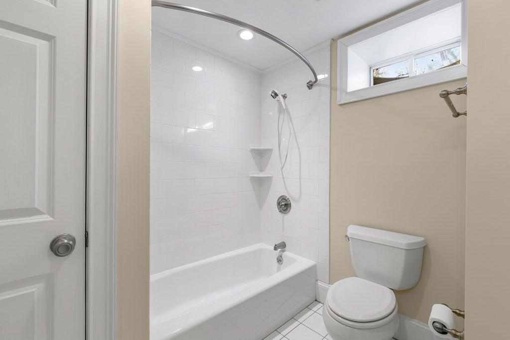 21 Ellison Road Lexington, MA 02421 - Photo 39 of 42 a white toilet sitting next to a bath tub shower