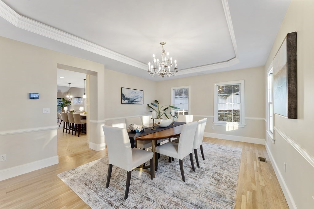 21 Ellison Road Lexington, MA 02421 - Photo 7 of 42 a dining room with furniture a chandelier and wooden floor