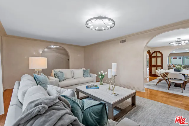 a living room with furniture and a table