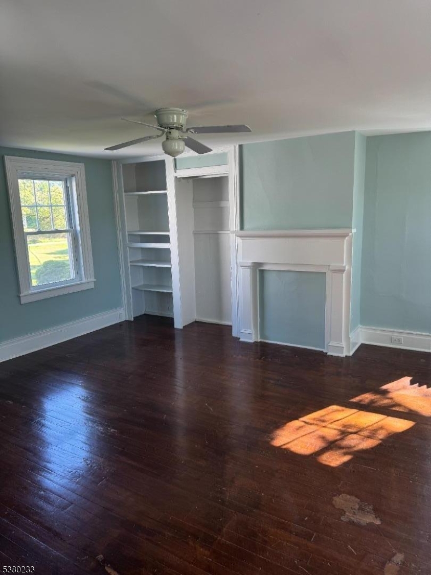 168 East Main Street Lebanon, NJ 08833 - Photo 20 of 26 a view of empty room with wooden floor and fireplace