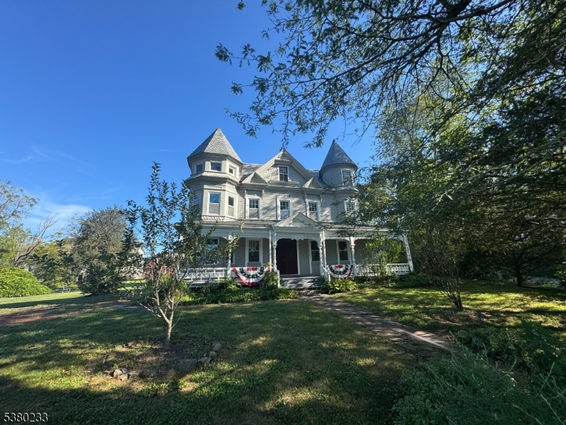 168 East Main Street Lebanon, NJ 08833 - Photo 2 of 26 a front view of a house with a yard table and chairs