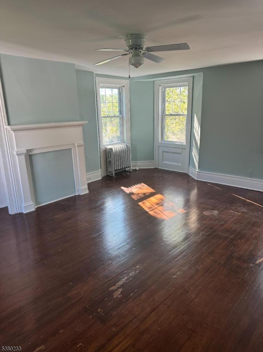 168 East Main Street Lebanon, NJ 08833 - Photo 21 of 26 an empty room with wooden floor and windows