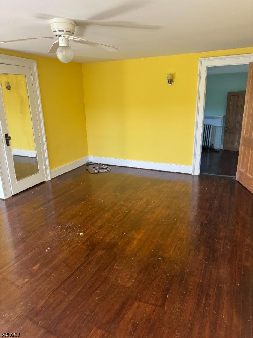 168 East Main Street Lebanon, NJ 08833 - Photo 22 of 26 a view of an empty room with wooden floor and a window