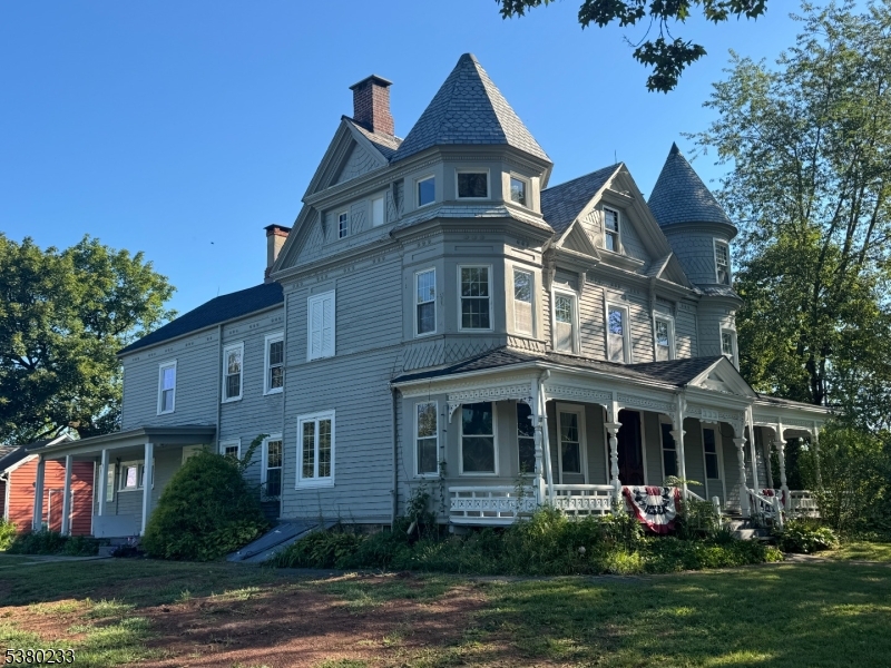 168 East Main Street Lebanon, NJ 08833 - Photo 3 of 26 a front view of a house with garden