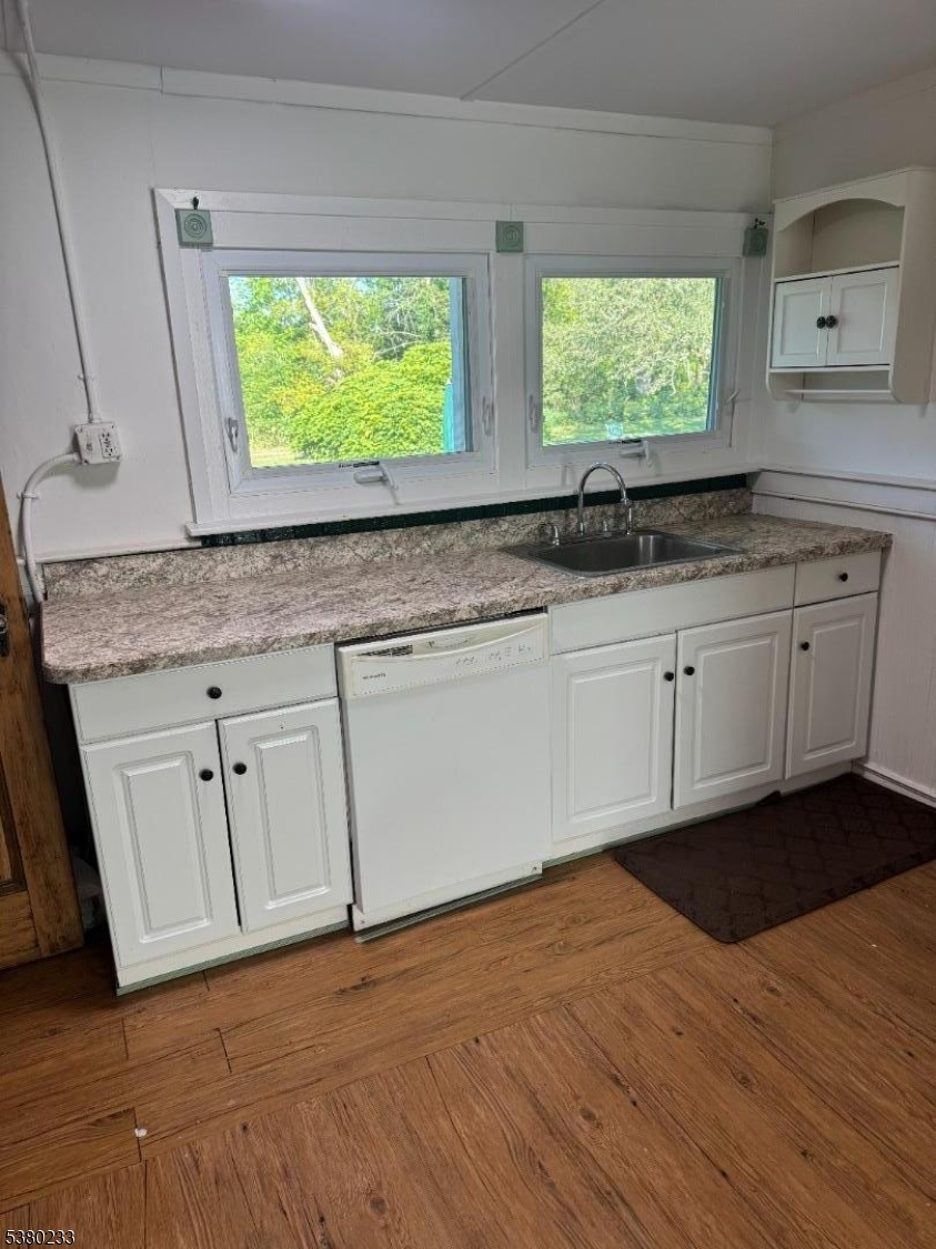 168 East Main Street Lebanon, NJ 08833 - Photo 8 of 26 a kitchen with granite countertop white cabinets and a sink
