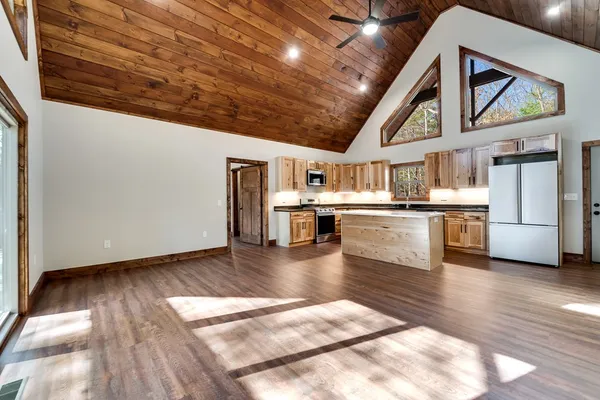 a view of kitchen with cabinets and wooden floor