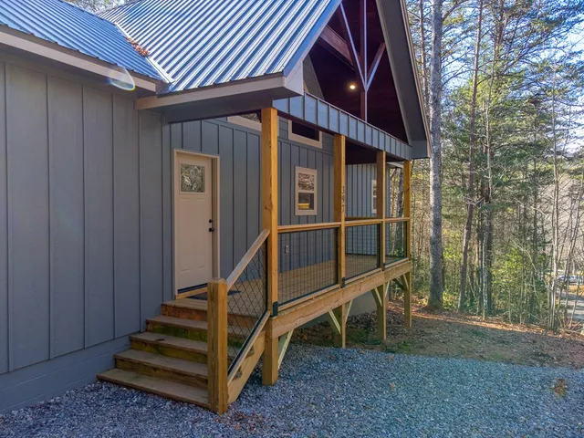a view of wooden house with a large window