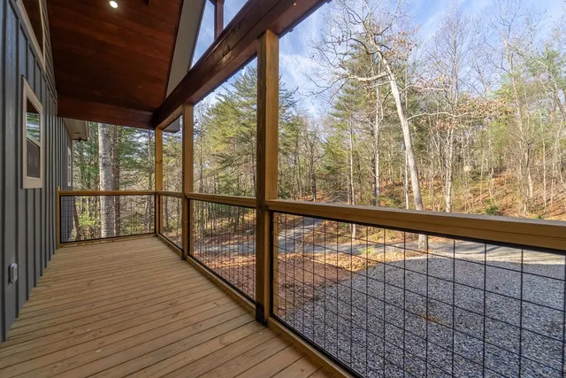 a view of balcony with wooden floor