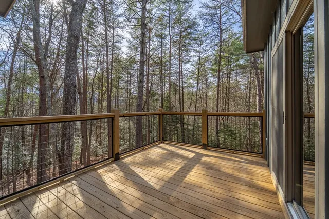 a view of a balcony with wooden floor
