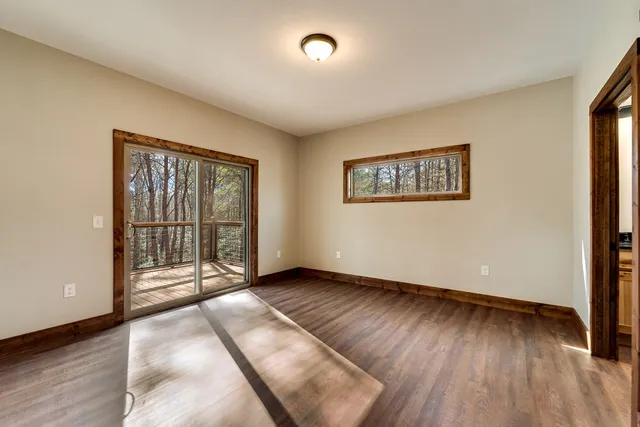 a view of an empty room with glass door