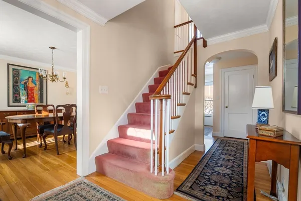 a view of entryway and hall with dining area