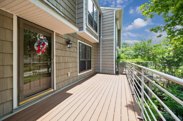 a view of wooden balcony with a potted plant