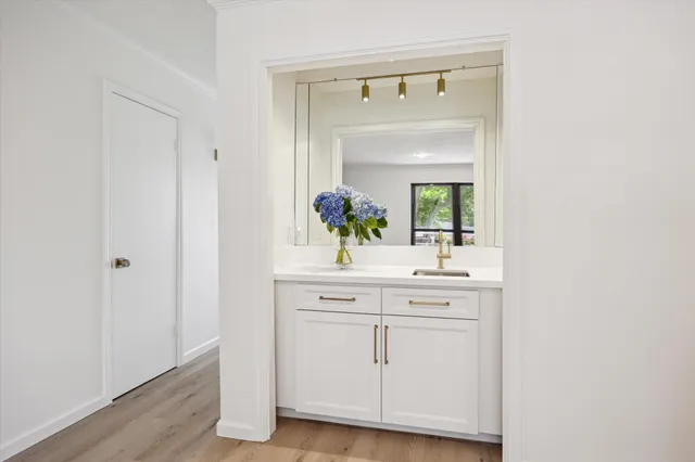 a bathroom with a sink and a mirror