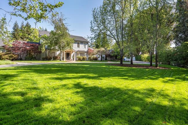 280 Ridgeway Road Woodside, CA 94062 - Photo 4 of 65 a view of a big house with a big yard and large trees
