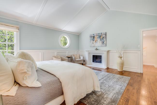 280 Ridgeway Road Woodside, CA 94062 - Photo 41 of 65 a spacious bedroom with a bed and a fireplace