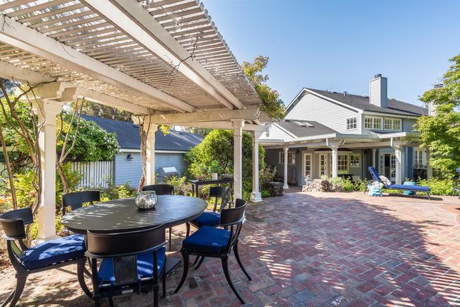 280 Ridgeway Road Woodside, CA 94062 - Photo 48 of 65 a view of a patio with table and chairs and potted plants