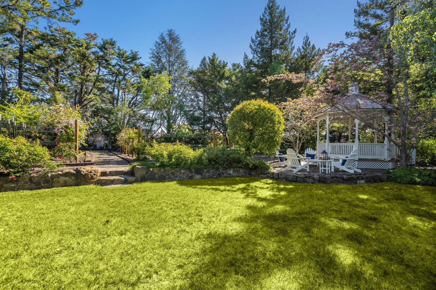 280 Ridgeway Road Woodside, CA 94062 - Photo 55 of 65 a view of a swimming pool with an outdoor space and seating area
