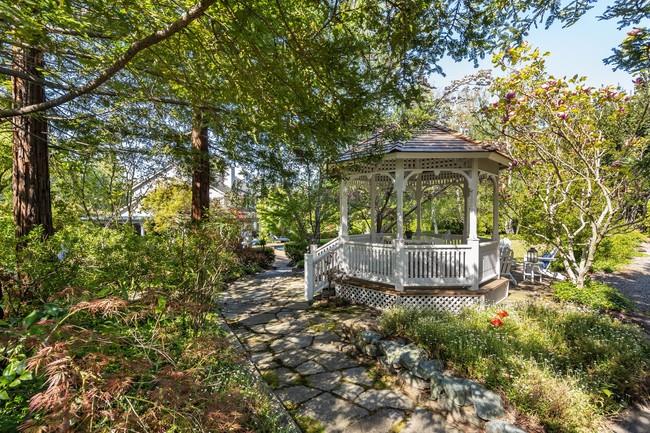280 Ridgeway Road Woodside, CA 94062 - Photo 56 of 65 a backyard of a house with yard and outdoor seating
