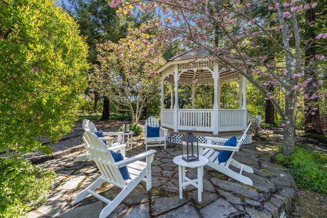 280 Ridgeway Road Woodside, CA 94062 - Photo 57 of 65 a view of patio with table and chairs and potted plants
