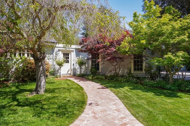 280 Ridgeway Road Woodside, CA 94062 - Photo 8 of 65 a front view of a house with a garden