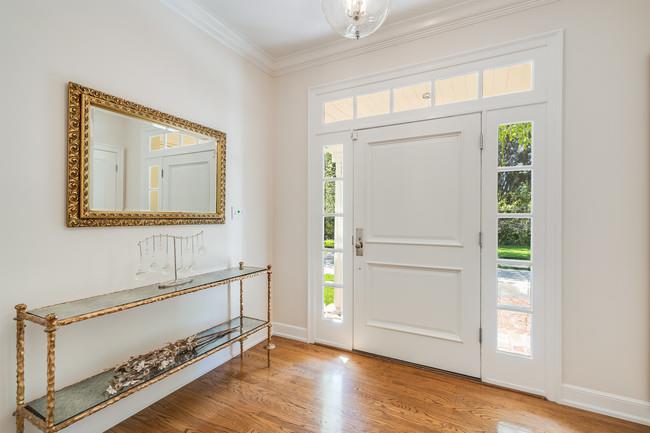 280 Ridgeway Road Woodside, CA 94062 - Photo 9 of 65 an entryway with wooden floor and cabinet