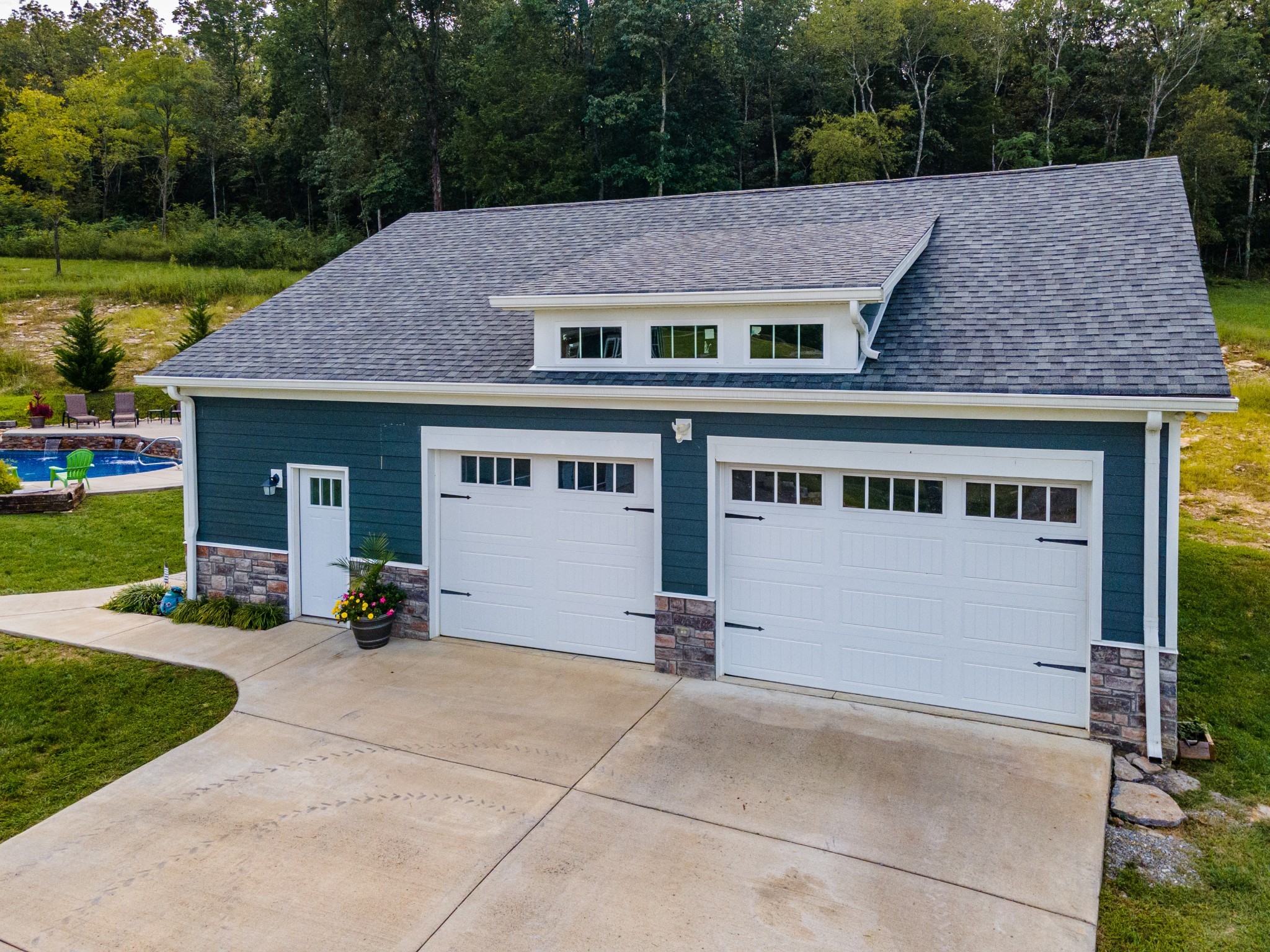 2740 Old Shannon Road Lebanon, TN 37090 - Photo 1 of 50 a front view of a house with a garden and sitting area