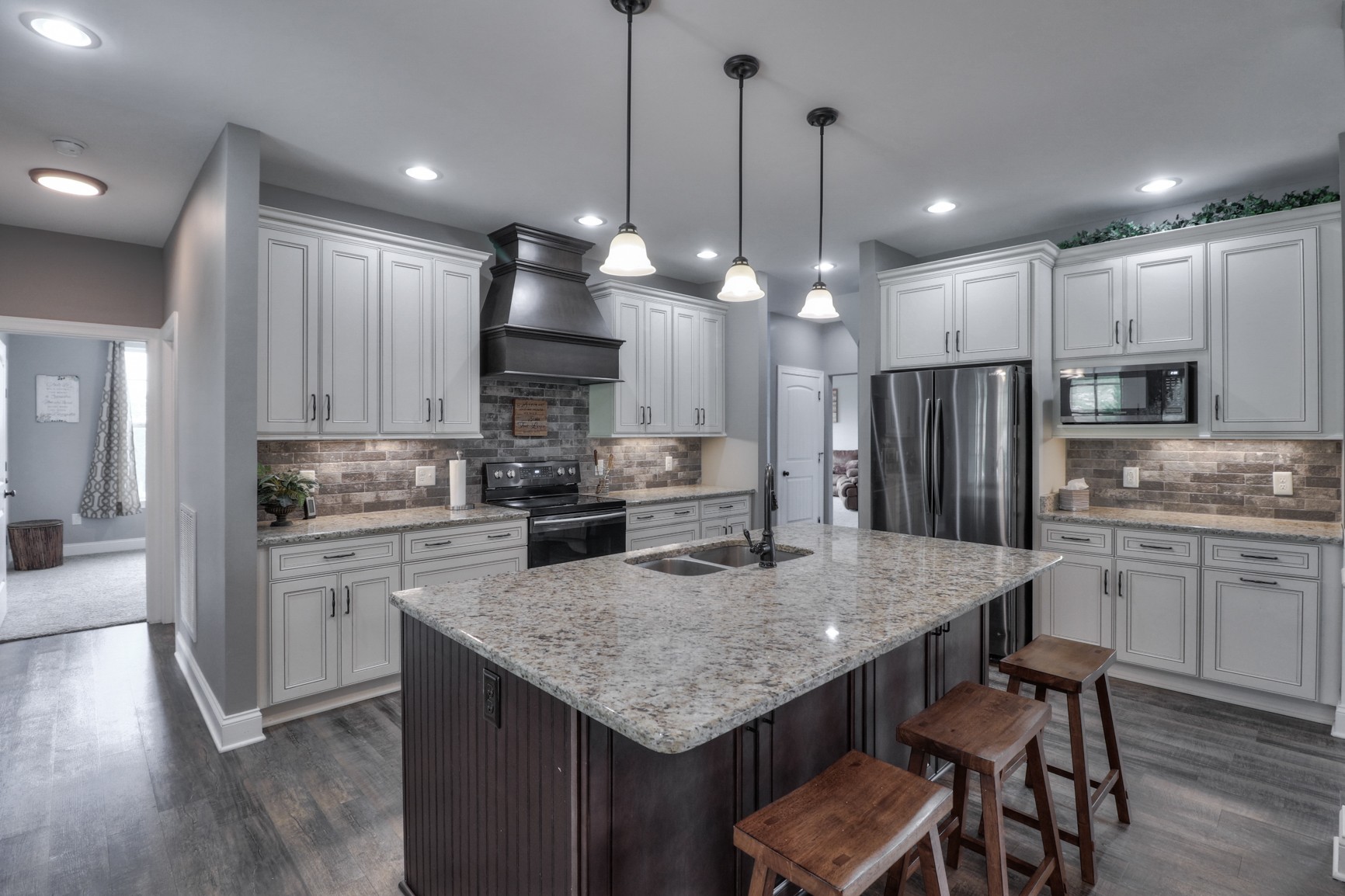 2740 Old Shannon Road Lebanon, TN 37090 - Photo 25 of 50 a kitchen with kitchen island granite countertop a sink a center island and stainless steel appliances