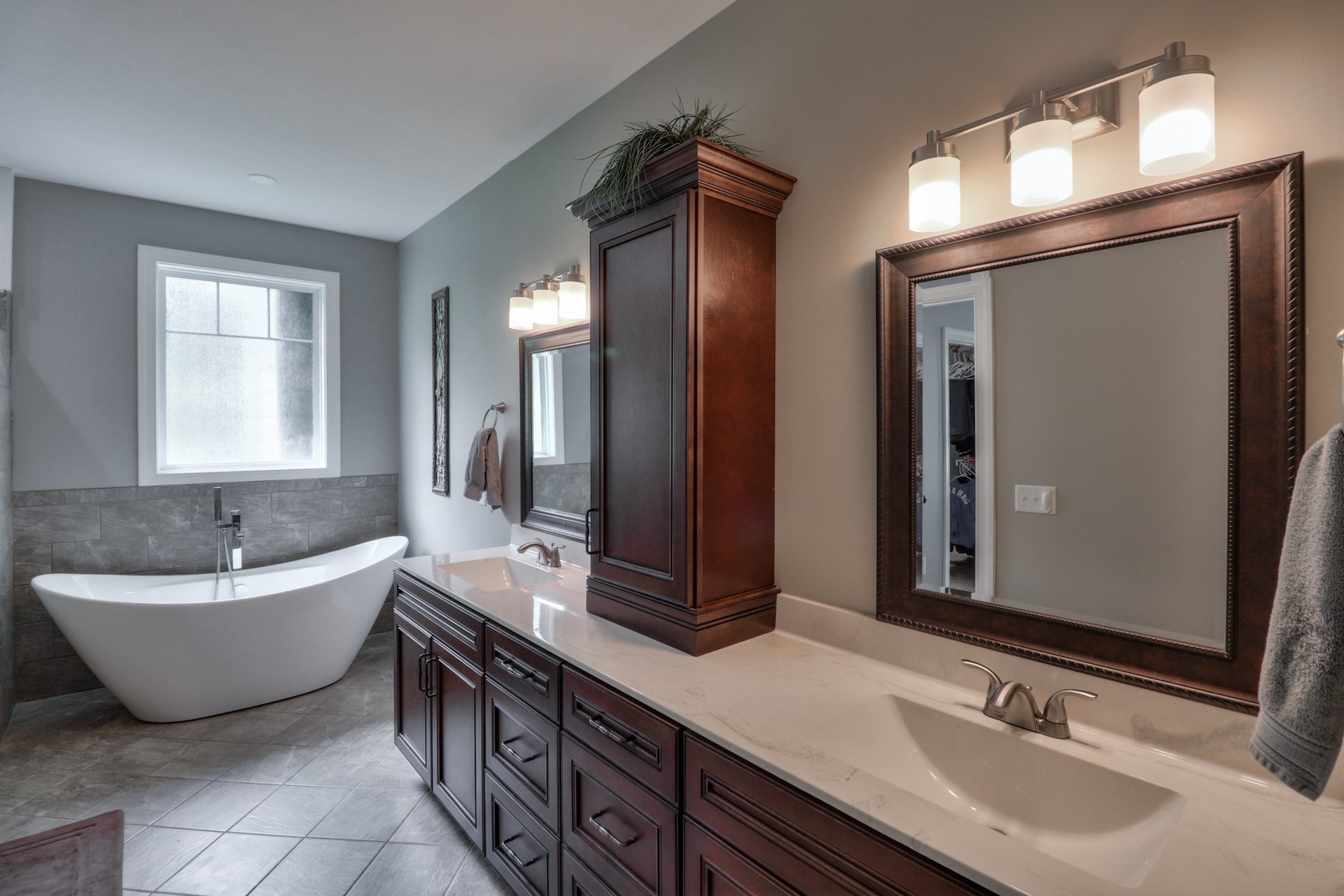 2740 Old Shannon Road Lebanon, TN 37090 - Photo 34 of 50 a bathroom with a double vanity sink large mirror and bathtub