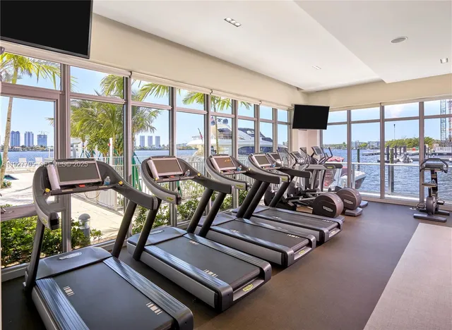 a view of a livingroom with furniture and staircase