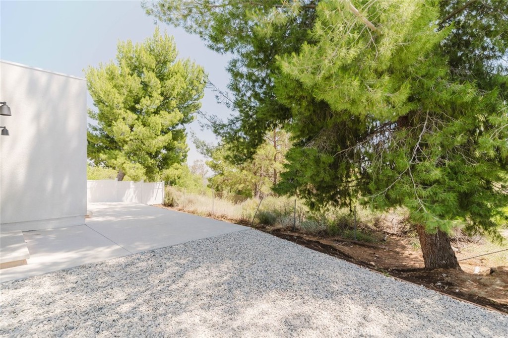 17846 Rinaldi Street Granada Hills, CA 91344 - Photo 28 of 34 a view of a yard with plants and trees