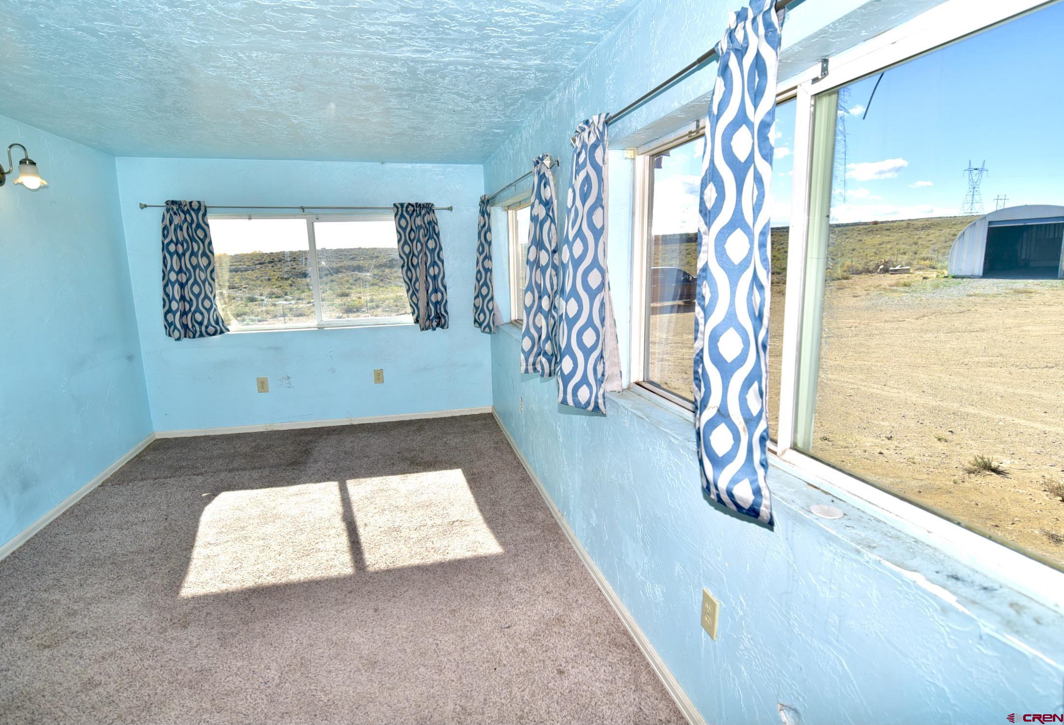 4499 Cedar Road Delta, CO 81416 - Photo 22 of 35 a view of an empty room with a window