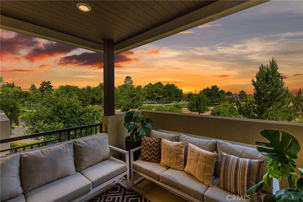 a roof deck with a table and chairs